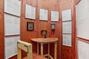 <p>Cheng Ran, <em>Circadian Rhythm</em>, 2013, edition of 3, mixed media installation (wooden partition walls, framed novel excerpts, oil painting, drawing, lamp, bar stool and table, lighting construction), reading room: 318 x 696 x 500 cm; lighting construction: 32 x 600 x 400 cm, detail</p>

