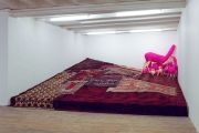 <p>Wiedemann/Mettler, <em>GEGENFELL</em>, 2010, polyurethane animal body, knit-wrapped acrylic, wood construction, oriental rugs, 500 x 430 x 20 to 150 cm</p>
