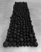 <p>Yang Mushi, <em isrender="true">Adhering</em>, 2013 - 2016, construction waste, black spray lacquer, 277 balls in different sizes, 18 x 433 x 132 cm, dimensions vary with installation</p>
