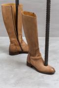 <p>Cao Yu, <em>Living, Nothing to Explain</em> (detail),&nbsp;2017, leather boots, screw-thread steels, concrete, 145 x 120 x 120 cm</p>
