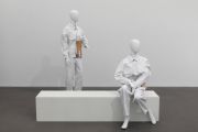 <p>Tobias Kaspar, <em>Extras</em>, 2019, mannequins with different material, Tobias Kaspar x FFixxed Studios uniforms, a wooden bench, painted white, 40 x 40 x 200 cm (bench); mannequins: 180 cm (standing); 130 cm (seating)</p>
