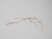 <p>Julia Steiner, <em>to and fro</em>, 2023, branch galvanized with copper, 130 x 40 x 50 cm, photo by Serge Hasenb&ouml;hler</p>
